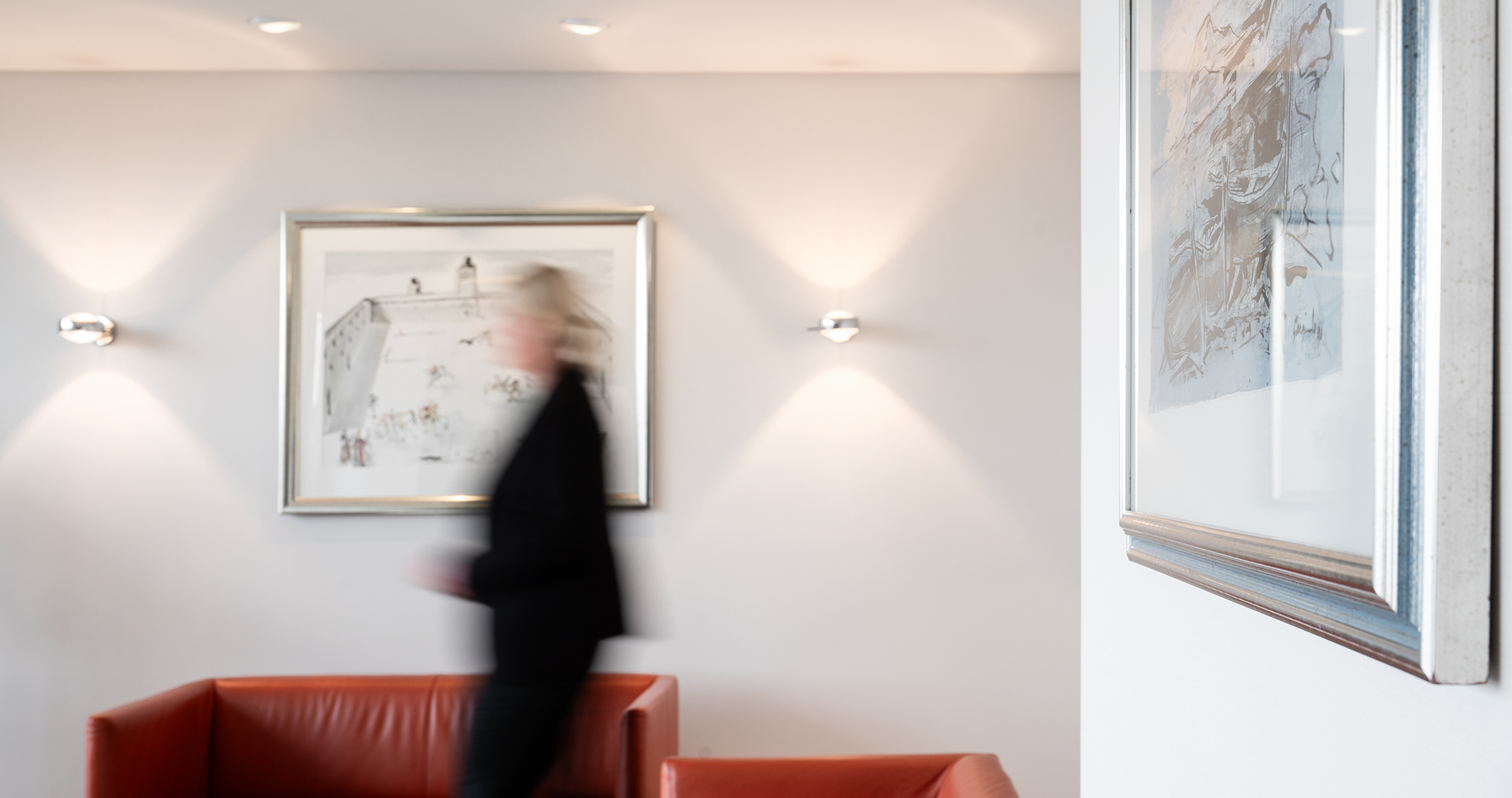 Working in the family office Office space with paintings on the wall